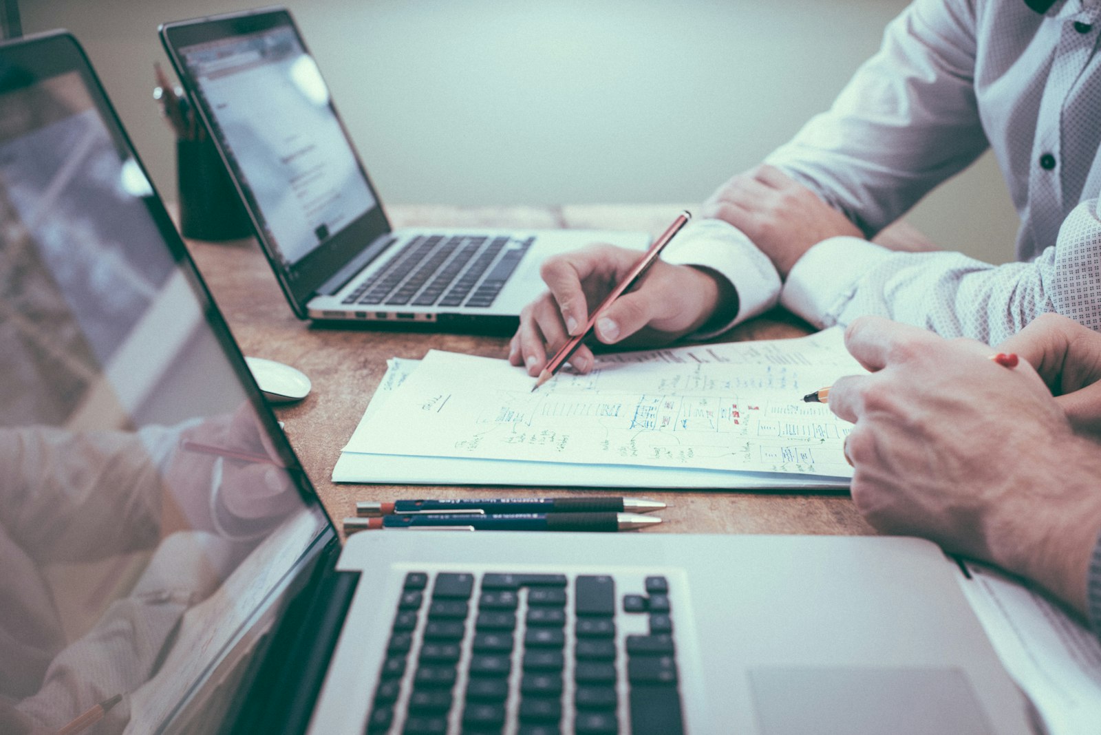Advisor reviewing charts with a client at a desk